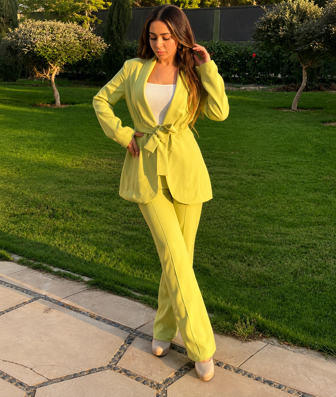 Lime yellow belted blazer and flare pants set - walking view